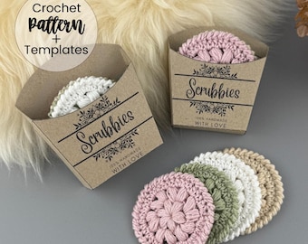 Könnte beinhalten: Gehäkelte Scrubbies in verschiedenen Farben, darunter Rosa, Grün, Weiß und Beige. Sie werden in kleinen braunen Pappschachteln präsentiert, die mit "Scrubbies" beschriftet sind und florale Akzente sowie den Text "100% Handmade With Love" aufweisen.
