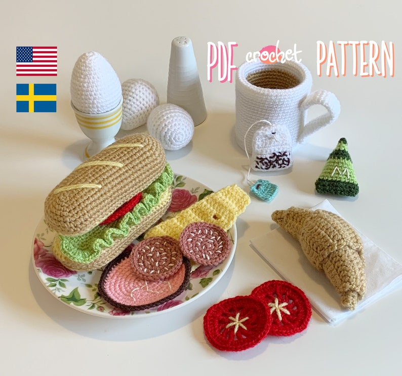 May include: Crochet amigurumi pattern for a breakfast themed set including a sandwich, croissant, eggs, coffee cup, and tea bag. The pattern is available as a PDF download.