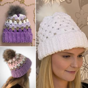 May include: Three crocheted hats with different color patterns and faux fur pom poms. The hats are purple, white, and a combination of purple, pink, and brown.