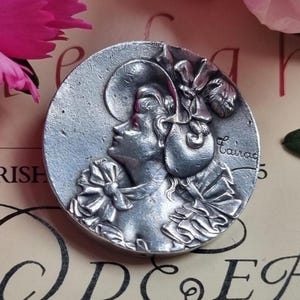 Antique French Signed Art Nouveau Silver Plated Lady In Bonnet Feathers and Frills Brooch