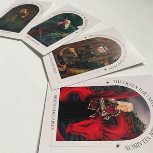 May include: Four white cards with black text and illustrations. The cards feature characters from the book "A Song of Ice and Fire" by George R.R. Martin. The text on the cards includes the names of the characters and their titles. The illustrations are in a fantasy style.