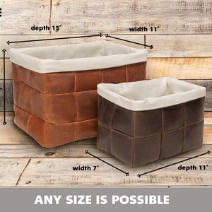 May include: Two leather storage baskets with fabric liners. The larger basket is brown and measures 15 inches deep, 11 inches wide, and 11 inches high. The smaller basket is dark brown and measures 11 inches deep, 7 inches wide, and 8 inches high. The text "ANY SIZE IS POSSIBLE" is at the bottom of the image.