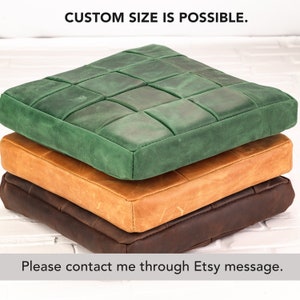 May include: Three square leather cushions stacked vertically. The top cushion is green, the middle is tan, and the bottom is dark brown. Each cushion features a grid-stitched pattern. Text reads: CUSTOM SIZE IS POSSIBLE. Please contact me through Etsy message.