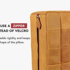 May include: A tan leather cushion featuring a square-stitched pattern and a metal zip closure on the side. The text on the image reads: WE USE A ZIPPER INSTEAD OF VELCRO. This adds rigidity and keeps the shape of the pillow.