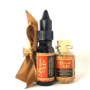 May include: A set of two small glass bottles with labels that read "Break Up". One bottle contains a dark liquid, the other a herbal blend. A gold ribbon and candle are also included.