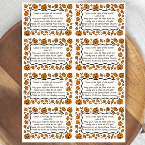 May include: A rectangular sheet containing eight identical white labels with black text and orange Halloween-themed borders. The text reads: "Jesus is the light of the world! John 8:12 May your night be filled with fun, candy and a little bit of Light! Please join us at Spring Place Church of God at 10:30 am Sunday morning."