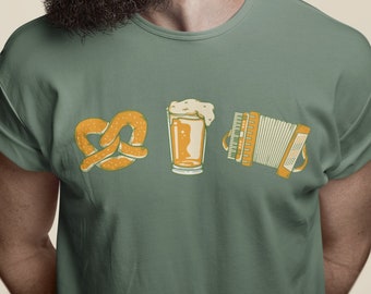 May include: A green t-shirt with a pretzel, beer stein, and accordion graphic. The shirt is on a person with a beard and sunglasses.
