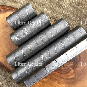 May include: Four metal rods with a wood grain pattern. The rods are approximately 2 inches long and are arranged in a stack. A ruler is visible in the background, with the text "Titan Crafts" appearing on the image.