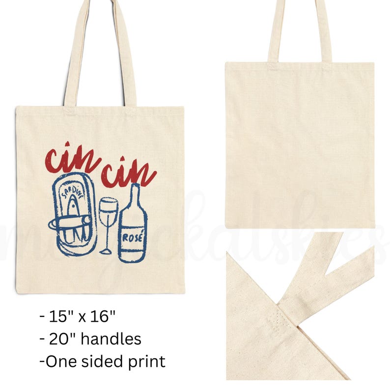 A natural colored cotton canvas tote bag. Design large in center of bag. Design says cin cin in fancy print in deep bright red all lowercase and curved on top of elements below. Elements pictured are thick sketched doodles of tinned sardines and a rose bottle with a wine glass in the center of both elements. Elements color is in bright coastal blue. Elements have a slight distressed look to them. For the fisherman aesthetic, Italian and mediterranean summer aesthetic, and sardine lovers.