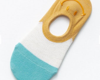 trainer socks with faces on the back