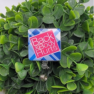 Back and body hurts badge reel