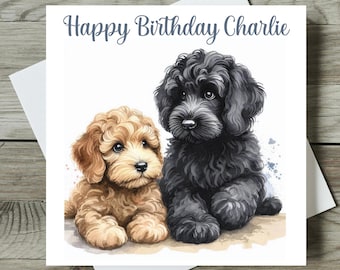May include: Happy Birthday Charlie card featuring a watercolor illustration of two adorable doodle dogs. One dog is black and the other is light brown.