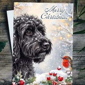 May include: A rectangular greeting card featuring a detailed illustration of a black curly-haired dog looking at a small robin perched on snow-covered holly berries. The background shows a snowy scene with glowing lights and the text Merry Christmas.