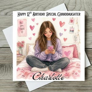 May include: A greeting card with a watercolor illustration of a young person sitting on a bed, looking at a phone. The card reads "Happy 12th Birthday Special Granddaughter" and "Charlotte". Pink hearts and decorative elements adorn the background.