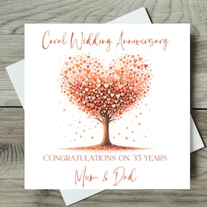 May include: A coral-colored wedding anniversary card with a heart-shaped tree design. The tree is composed of numerous small hearts in shades of coral and orange. The card reads "Coral Wedding Anniversary," "Congratulations on 35 Years," and "Mum & Dad."