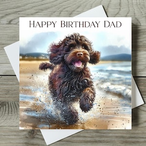 May include: A greeting card with the text "HAPPY BIRTHDAY DAD" features a watercolor illustration of a brown dog running through water on a beach. The dog has a happy expression, with its tongue out.