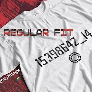 May include: White t-shirt with black text that reads "REGULAR FIT 15398642_14" and a black circle with a white ring inside.