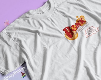 May include: White t-shirt with a red, yellow, and black graphic of the word "Bonk" with the text "Atomic Punch Cherry Fission Now with Isotopes!"