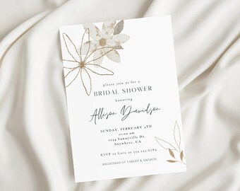 May include: A white card with gold floral illustrations and text that reads "Please join us for a Bridal Shower honoring Allison Davidson. Sunday, February 4th, 1:00 pm, 1234 Sunnyside Dr, Anywhere, CA. RSVP to Laura at 555-555-5555. Registered at Target & Amazon."
