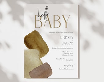 May include: A baby shower invitation with a watercolor background in shades of brown and beige. The text reads "hello BABY" in gold lettering, followed by the names "LINDSEY & JACOB", the date and time of the event, the location, and RSVP information. The invitation also includes the text "registered at Buy Buy Baby & Amazon".