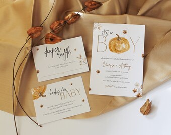 May include: Three cards with fall-themed designs for a baby shower. The cards are white with gold lettering and feature a pumpkin, leaves, and flowers. The text on the cards reads "It's a Boy", "Diaper Raffle", and "Books for Baby".