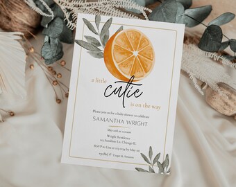 May include: A white baby shower invitation with a watercolor illustration of an orange slice and green leaves. The text reads "a little cutie is on the way". The invitation includes the name Samantha Wright, the date, time, and location of the shower.