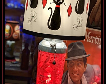 Vintage Cocktail Shaker Lamp featuring The Rat Pack,  Marilyn Monroe and other retro images.