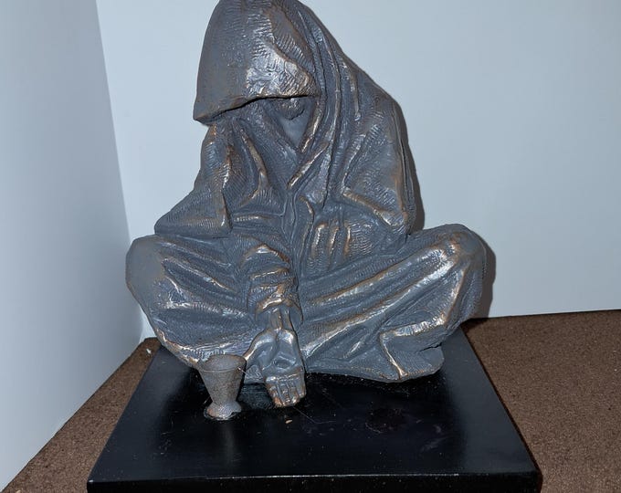 When I Was Hungry and Thirsty Statue by Timothy Schmalz