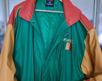 May include: A green, yellow, and red leather jacket with a zipper closure and a patch that says "Africa" with a flag on it.