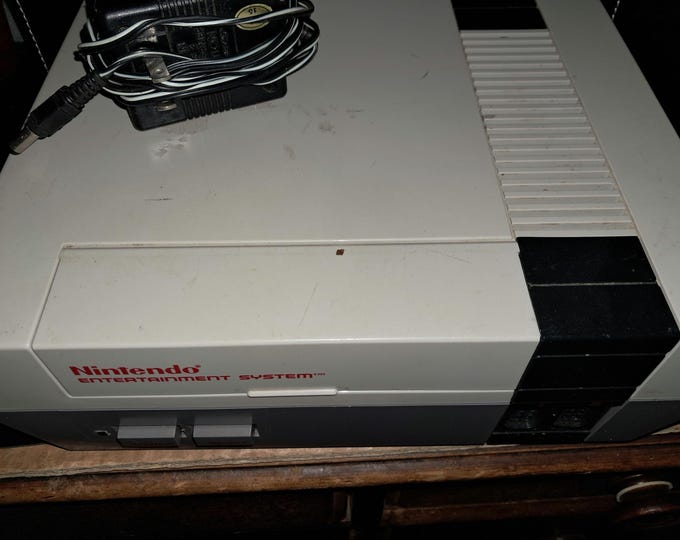 Nintendo Entertainment System with Assortment  of  Nintendo Controllers and  Games