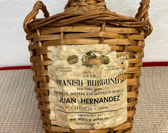 1959 Spanish Burgundy Empty Wicker Covered  Bottle by Juan Hernandez. Valencia Spain