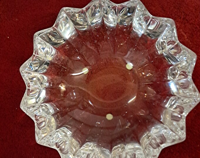 Orrefors Fleur Bowl is a hand-cut, glistening crystal bowl with an asymmetrical design