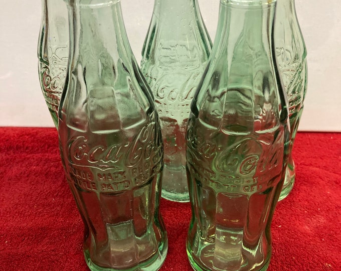 Five Vintage Coca Cola Glass Bottles.