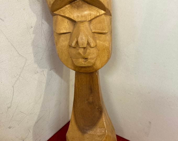 Vintage solid wood sculpture. Two tone natural  wood  color.