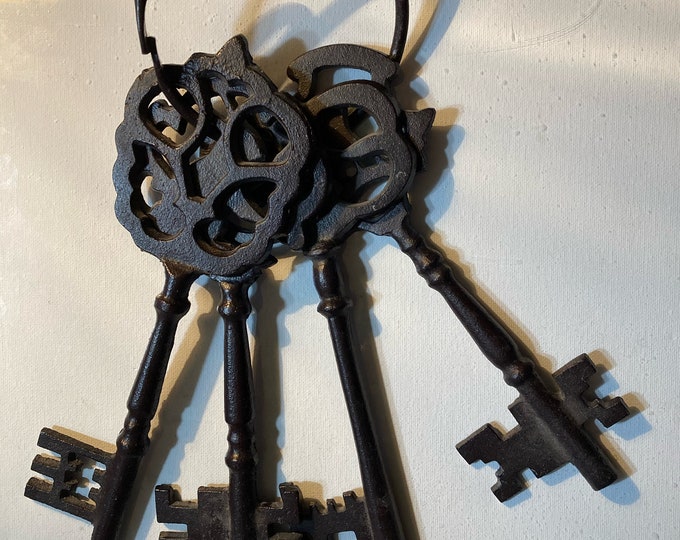Four Large Metal Keys   In A  Loop To Hang