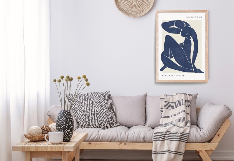 May include: A framed print of a blue abstract figure, titled "Blue Nude II, 1952" by H. Matisse.