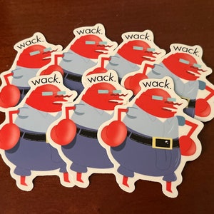 May include: A collection of stickers featuring a cartoon crab character with a red body, blue pants, and a light blue shirt. The crab has a mustache, glasses, and the word "wack" above its head. The stickers are on a brown surface.