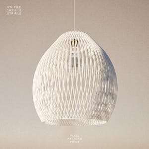 May include: White pendant light with a woven, cage-like design. The light fixture has a teardrop shape and hangs from a thin cord. The text "STL FILE, 3MF FILE, STP FILE" and "PIXEL PATTERN PRINT" are visible.