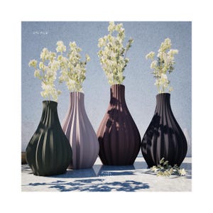 May include: Four ceramic vases in different colors, each with a unique ribbed design. The vases are filled with white flowers and arranged in a row on a gray surface.