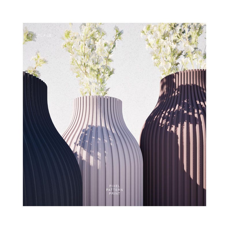 May include: Three vases with a ribbed design in shades of gray, black, and brown. The vases are filled with white flowers. The text "PIXEL PATTERN PRINT" is visible on the front of the middle vase.