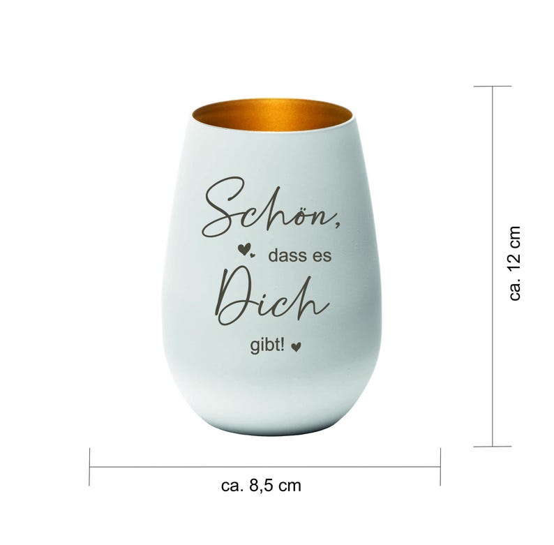 May include: A white, egg-shaped candle holder with a gold interior. The candle holder is approximately 4.7 inches tall and 3.3 inches wide. The text "Sch&ouml;n, dass es Dich gibt!" is written on the front.