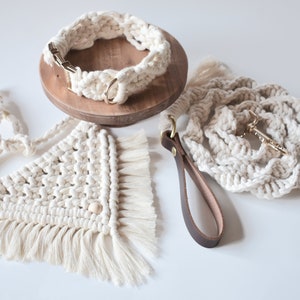May include: A set of three handmade dog collars and leashes made from macrame rope. The collars and leashes are cream colored and have a fringe detail. The set includes a collar, a leash, and a separate lead.