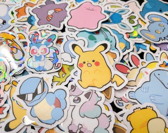 May include: A selection of colourful, die-cut stickers featuring various cartoon characters. The stickers showcase a variety of designs, including a yellow Pikachu, a blue Squirtle wearing sunglasses, and other popular characters. The stickers have a glossy finish.