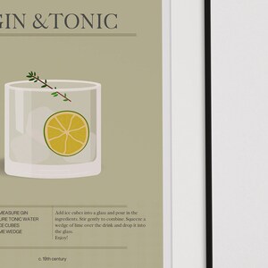May include: A framed print featuring a Gin & Tonic cocktail illustration. The image shows a clear glass with ice cubes, a lime wedge, and a sprig of thyme. The text "GIN & TONIC" is at the top.