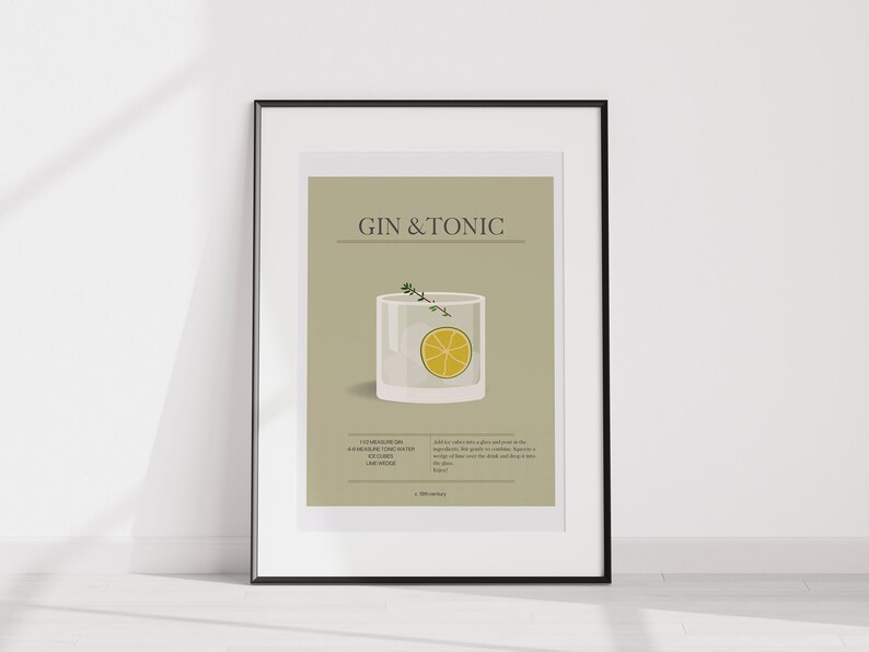 May include: A framed print featuring a Gin & Tonic cocktail illustration. The artwork includes a detailed depiction of the drink in a glass, a lime wedge, and sprigs of herbs. The text "GIN & TONIC" is displayed at the top.