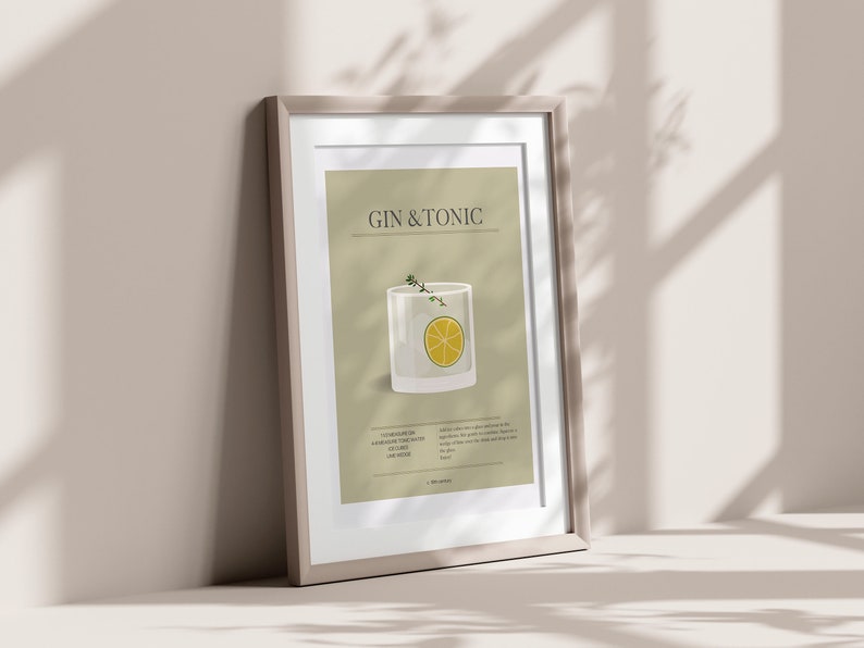 May include: Framed art print featuring a Gin & Tonic cocktail illustration. The artwork displays a glass with a lemon slice and herbs, set against a neutral background. The print includes the drink's name and ingredients.
