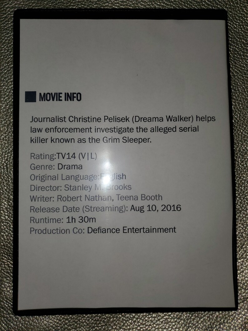 May include: Movie info card with white background and black text. The title is "Movie Info". The text describes the movie "Grim Sleeper" with details about the genre, director, writer, release date, runtime, and production company.
