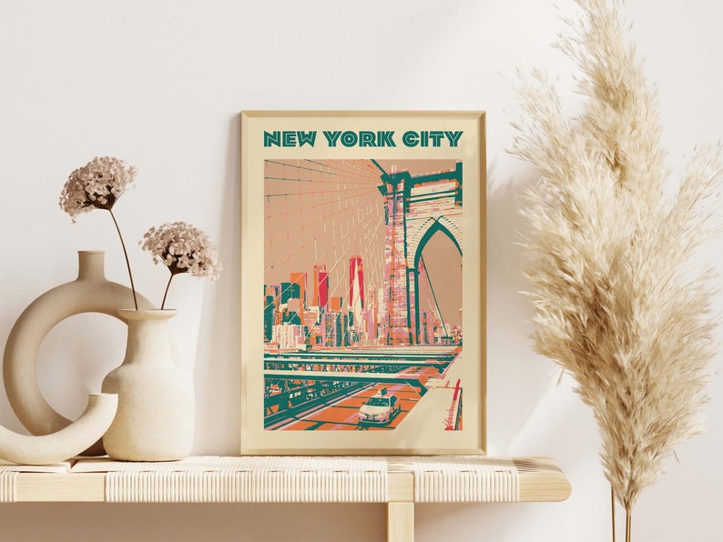 May include: A vintage-style poster with the text "NEW YORK CITY" in teal and white lettering. The poster features a colorful illustration of the Brooklyn Bridge with the New York City skyline in the background.