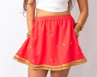 Minigonna Siren con bordo dorato e tasche