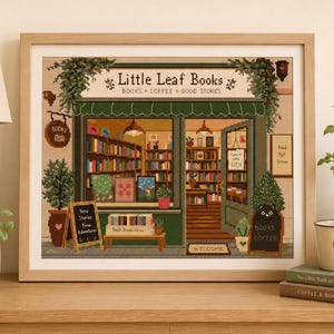 May include: A framed cross-stitch pattern depicting a bookstore named Little Leaf Books with the text Books, Coffee, Good Stories. The scene features a green storefront, bookshelves, a black cat, potted plants, and signs reading New Stories New Adventures and Come in we're OPEN.